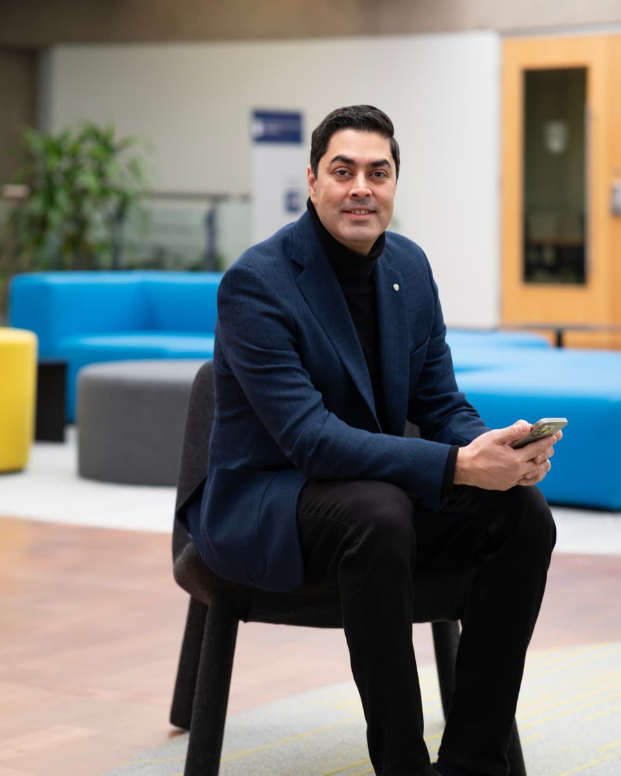 Reza Masinaei, Co-Founder and Director of Synova, speaking at a UBC podium